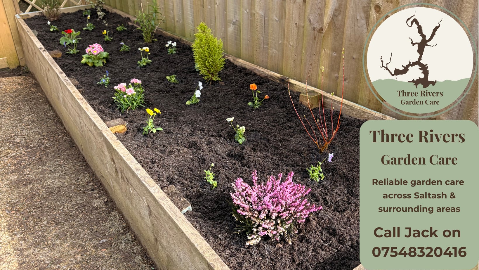 Newly planted raised flower bed with colourful plants
